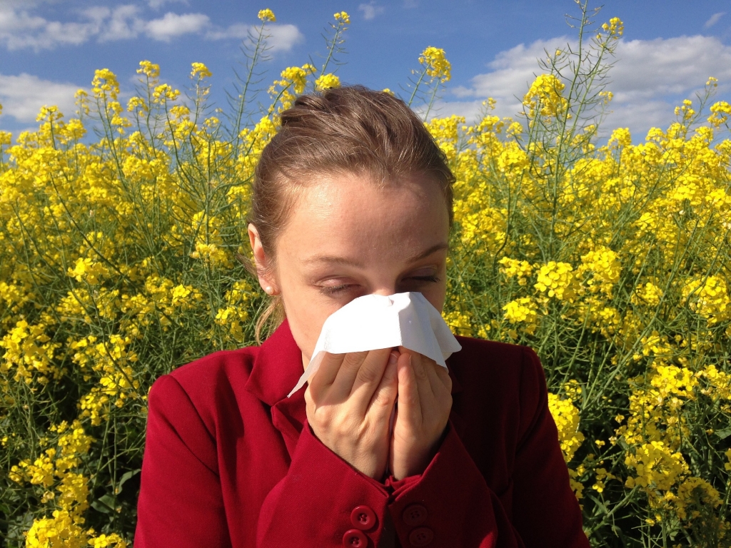 A girl blowing her nose