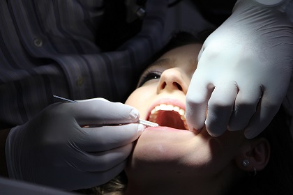Young lady at the dentist for a professional dental cleaning