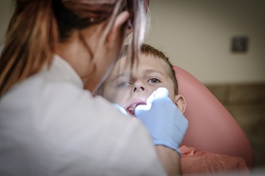 A young boy at the pediatric dentist